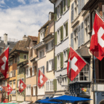 charming-old-town-street-adorned-with-swiss-flags-2025-04-05-07-24-33-utc
