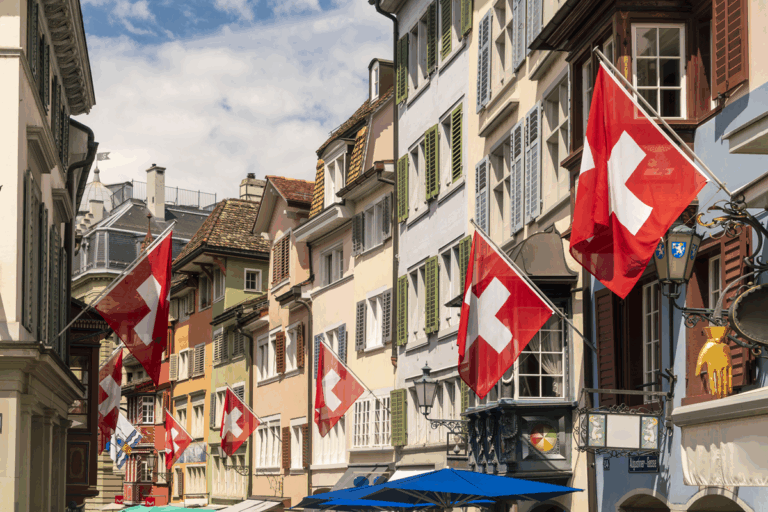 charming-old-town-street-adorned-with-swiss-flags-2025-04-05-07-24-33-utc