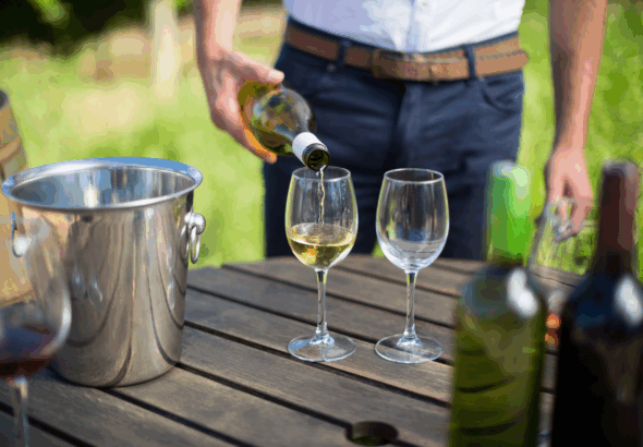 mid-section-of-man-pouring-wine-in-glass-2025-04-03-22-22-29-utc