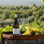 white-wine-and-grape-bunch-on-barrel-in-vineyard-d-2025-03-26-23-14-43-utc